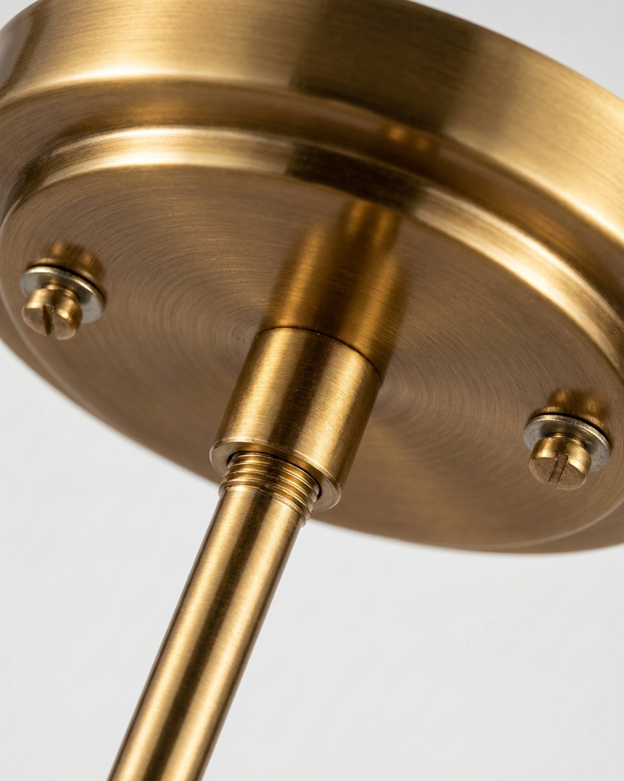 Close-up of a gold ceiling fixture on a light gray background