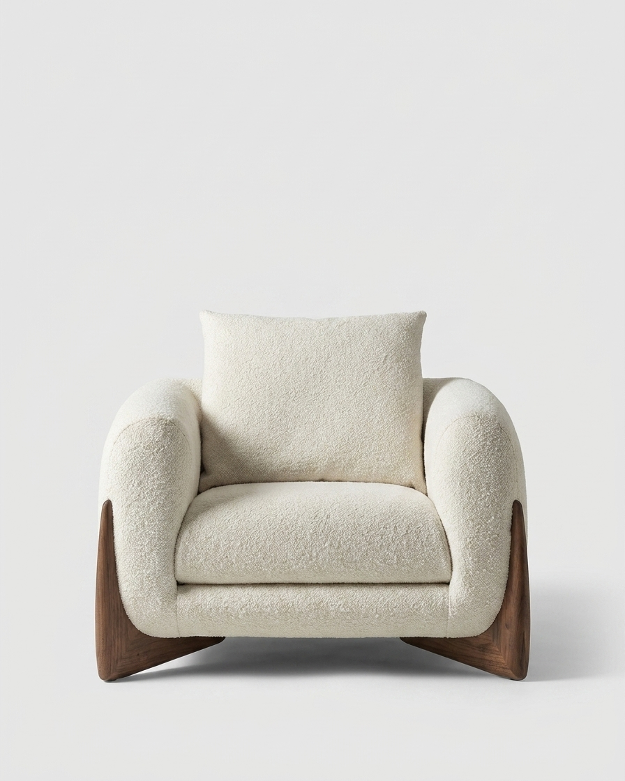 Beige armchair with wooden legs on a light gray background