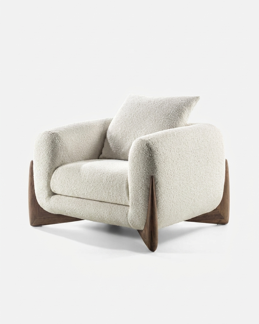 Modern armchair with wooden legs on a white background