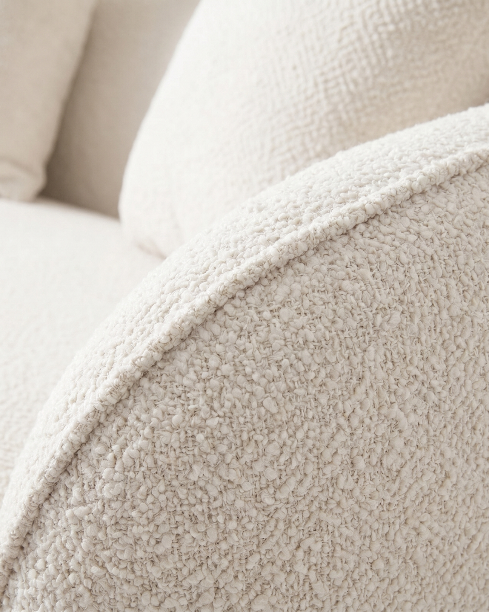 Close-up of a textured beige fabric surface