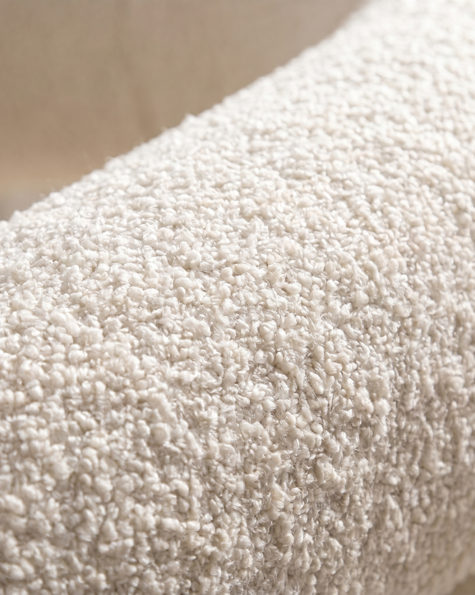 Close-up of a textured beige fabric surface