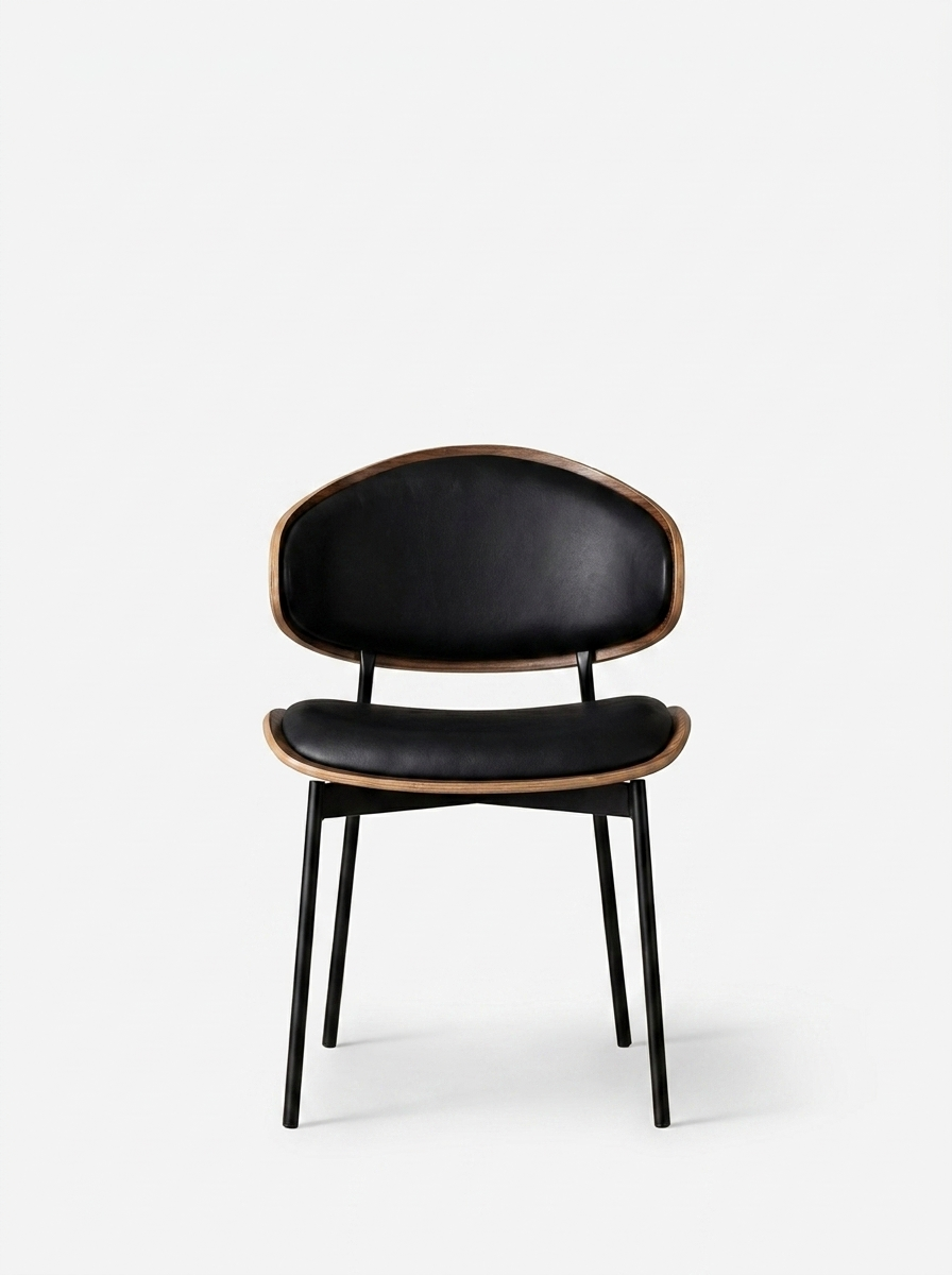 Eik Dining Chair in black leather with walnut veneer and steel frame
