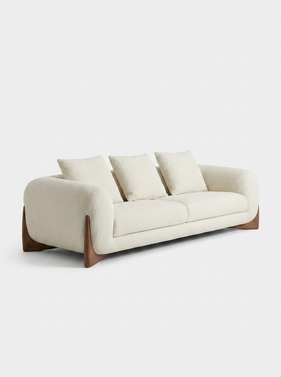 Favn Lounge Sofa in Bone Cream, angled view with wooden legs