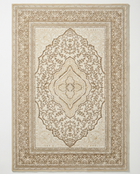 Decorative beige and brown area rug with intricate patterns on a white background