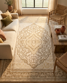 Living room with a patterned rug, sofa, and chairs.