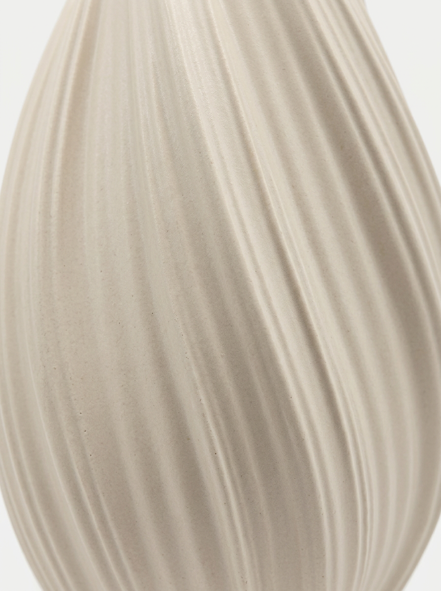 Krusad ceramic vase styled on a shelf, matte cream ceramic