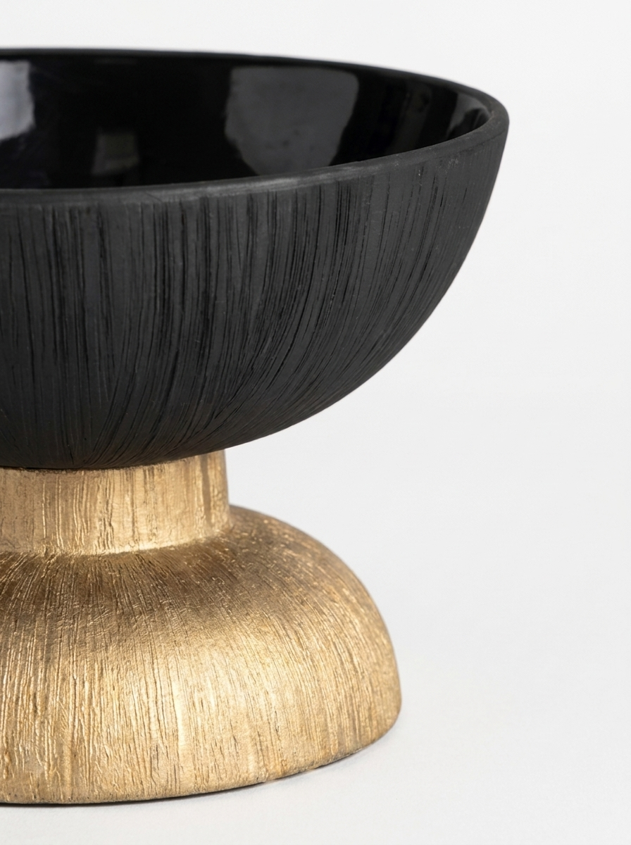 Kupa Ceramic Bowl, close-up of brushed gold pedestal base and matte black bowl