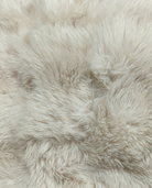 Close-up of beige fluffy fabric texture