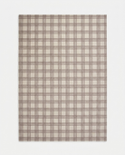 Plaid patterned fabric swatch on a white background