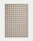 Plaid patterned fabric swatch on a white background
