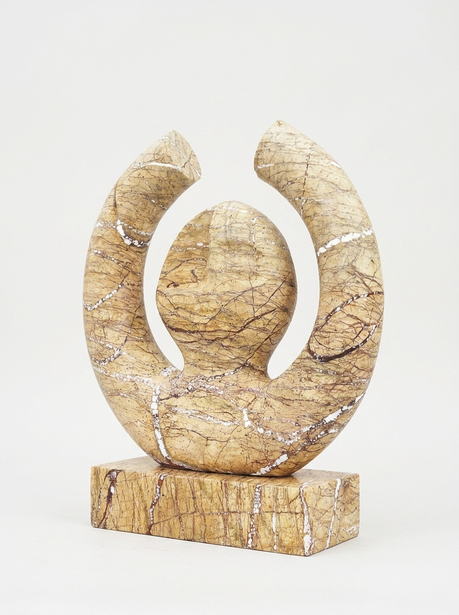 Sola Sculpture, solid marble sculpture, close-up view of open circular form