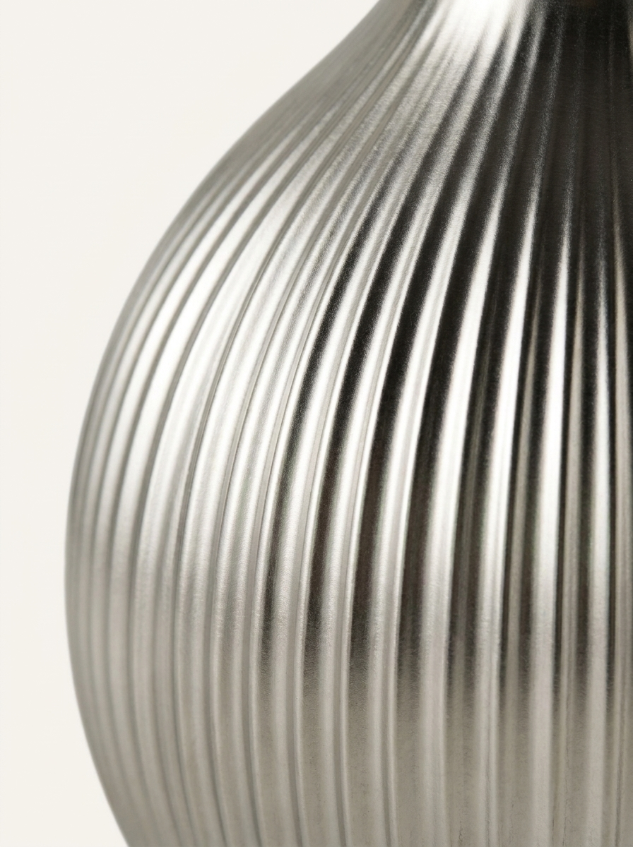 Stral Bud Vase, close-up of ribbed metallic silver texture