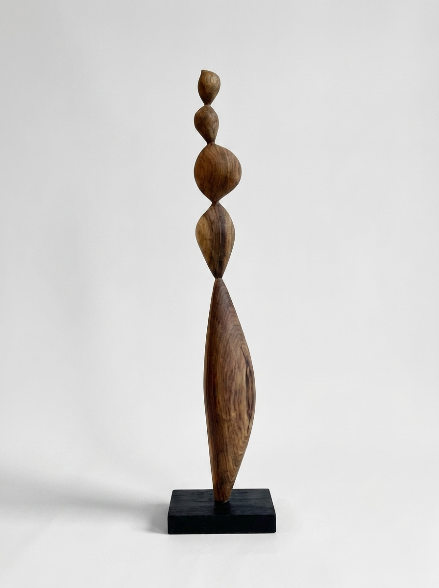 Tumla wooden sculpture in solid South American walnut, stacked vertical form