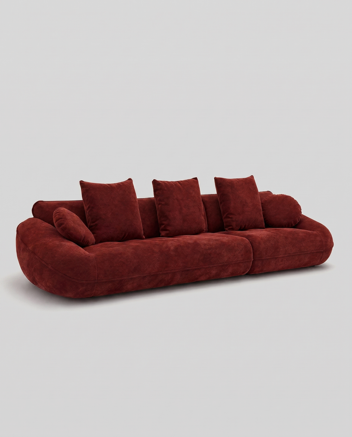 Velor Sculptural Velvet Curved Sofa in Terra Rust, angled view