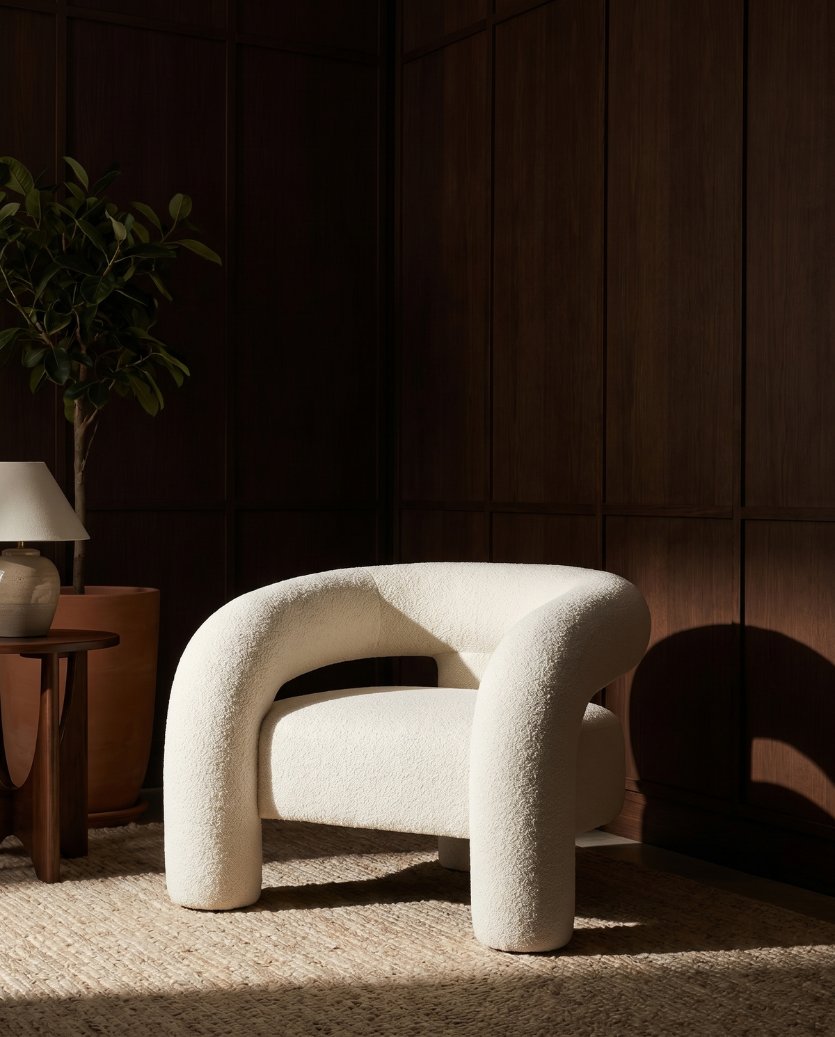 Voss Bouclé Armchair in Oatmeal Pebble, styled in a wood-panelled room